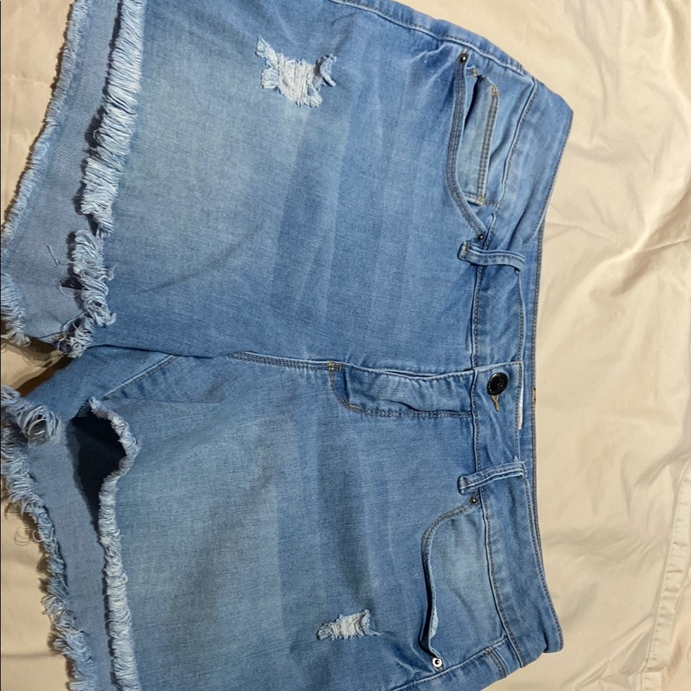 Women’s size 14 light denim distressed shorts.
